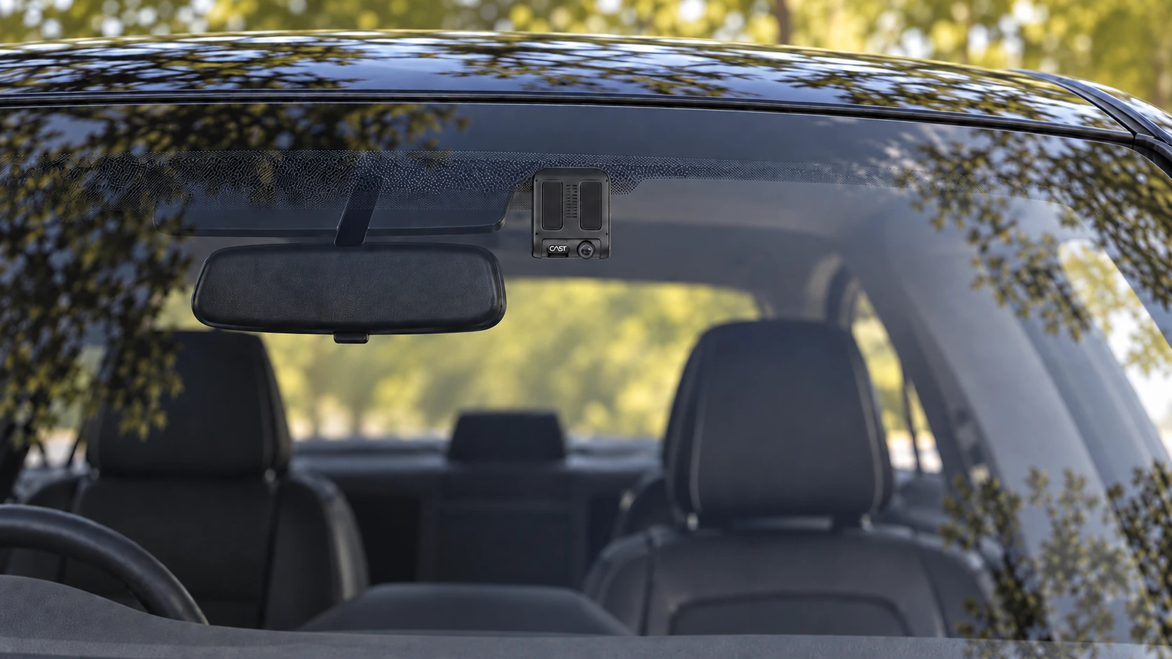 Dashcam position at the top of the windshield near the rearview mirror, with the CAST logo facing outward